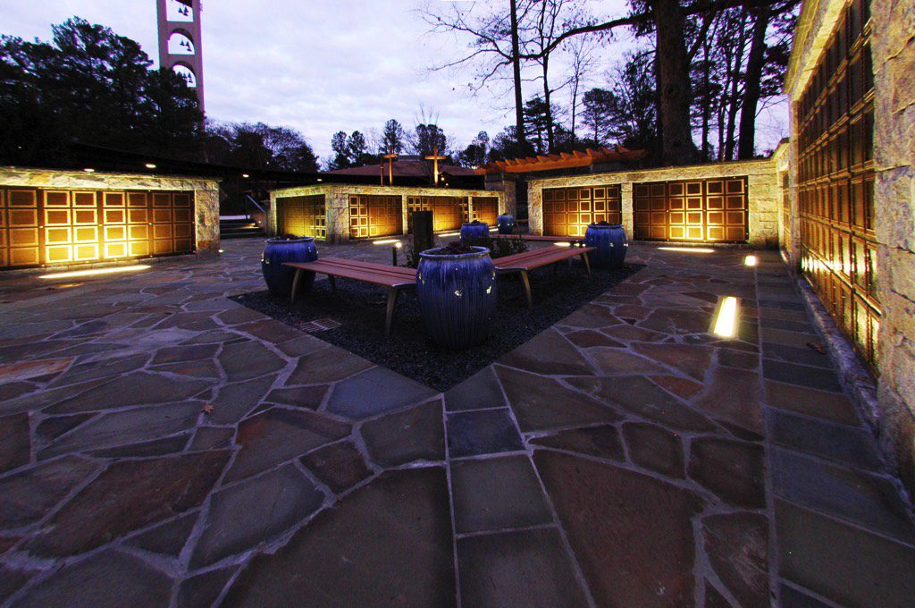 All Saints Catholic Church Columbarium Benches and Planters at Dusk with Lights